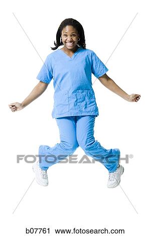 African-American nurse jumping in air View Large Photo Image Stock Image - African-American nurse jumping in air. Fotosearch