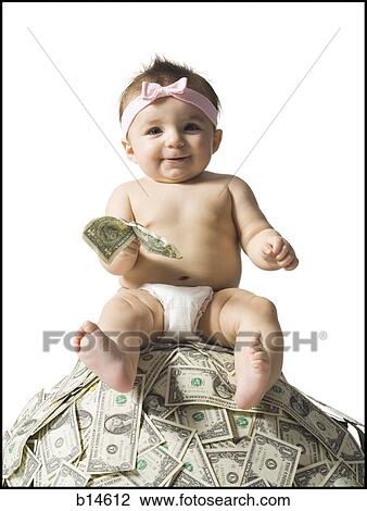 Baby girl sitting on pile of US currency View Large Photo Image Stock Image - Baby girl sitting on pile of US currency. Fotosearch