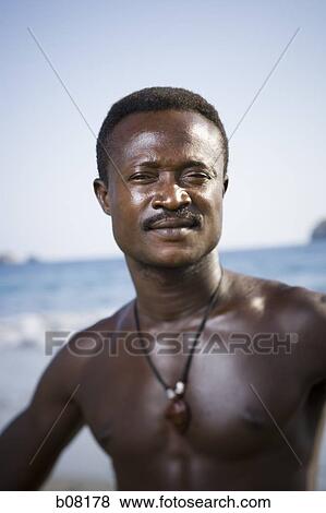 Black male posing for portrait on beach View Large Photo Image Stock Photo - Black male posing for portrait on beach. Fotosearch