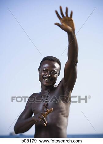 Black male posing for portrait on beach View Large Photo Image Stock Photo - Black male posing for portrait on beach. Fotosearch