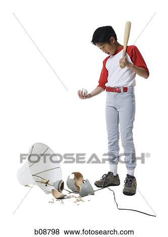 Boy holding a baseball bat with a ball, looking down at a broken lamp View Large Photo Image Stock Photo - Boy holding a baseball bat with a ball, looking down at a broken lamp. Fotosearch