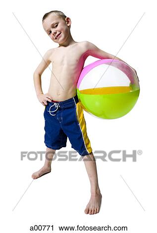 Boy holding beach ball View Large Photo Image Stock Image - Boy holding beach ball. Fotosearch
