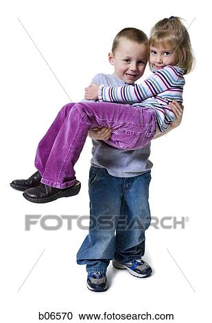 Boy holding girl View Large Photo Image Stock Image - Boy holding girl. Fotosearch