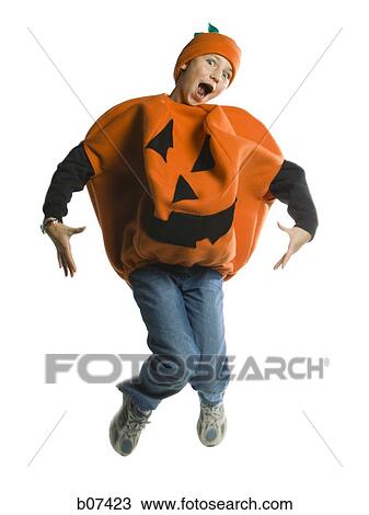 Boy in a halloween pumpkin costume View Large Photo Image Stock Image - Boy in a halloween pumpkin costume. Fotosearch