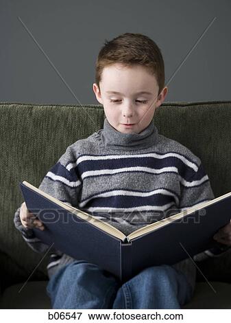 Boy reading book View Large Photo Image Stock Photo - Boy reading book. Fotosearch