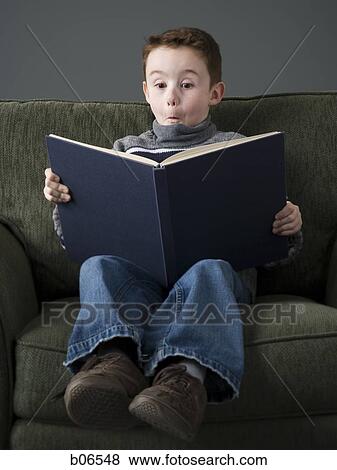 Boy reading book View Large Photo Image Stock Photo - Boy reading book. Fotosearch