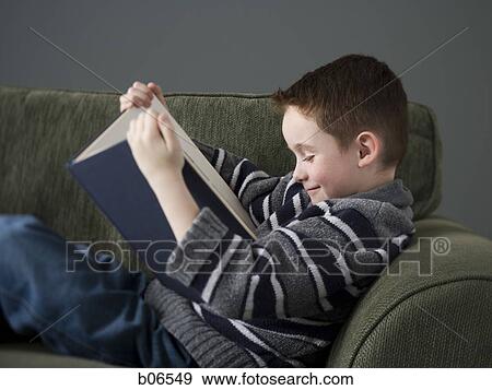 Boy reading book View Large Photo Image Stock Photo - Boy reading book. Fotosearch