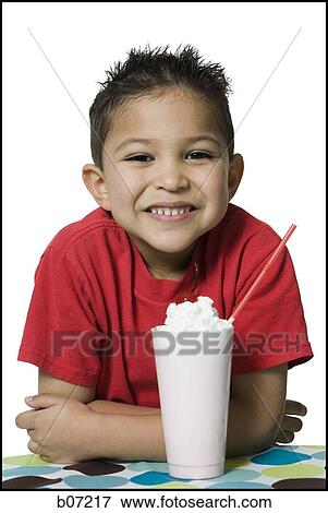 Boy smiling with milkshake View Large Photo Image Stock Photo - Boy smiling with milkshake. Fotosearch