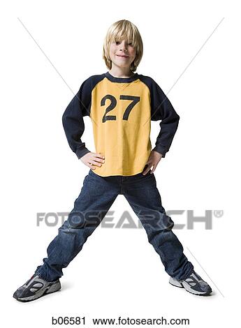 Boy standing with hands on hips View Large Photo Image Stock Image - Boy standing with hands on hips. Fotosearch