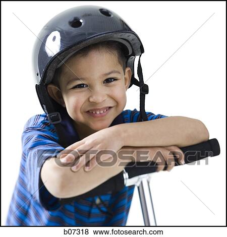 Boy with helmet and scooter View Large Photo Image Stock Photo - Boy with helmet and scooter. Fotosearch