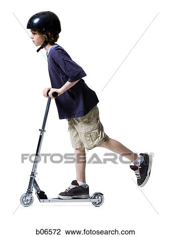 Boy with helmet riding on scooter View Large Photo Image Stock Image - Boy with helmet riding on scooter. Fotosearch