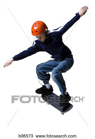 Boy with helmet riding skateboard View Large Photo Image Stock Image - Boy with helmet riding skateboard. Fotosearch