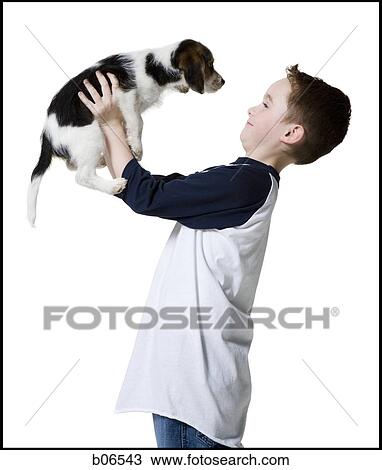Stock Image - Boy with puppy. Fotosearch