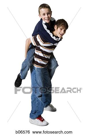 Brothers posing piggy back View Large Photo Image Stock Photograph - Brothers posing piggy back. Fotosearch