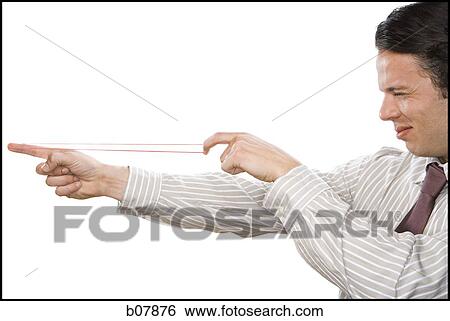 Businessman aiming to shoot a rubberband View Large Photo Image Stock Photograph - Businessman aiming to shoot a rubberband. Fotosearch