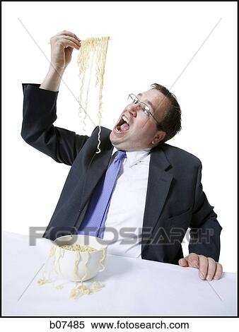 Businessman awkwardly eating noodles View Large Photo Image Stock Photography - Businessman awkwardly eating noodles. Fotosearch