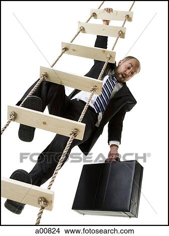 Businessman climbing a ladder with briefcase View Large Photo Image Picture - Businessman climbing a ladder with briefcase. Fotosearch