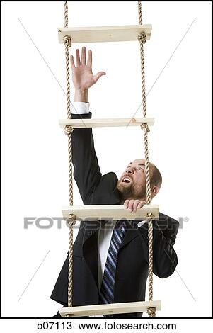 Businessman climbing ladder View Large Photo Image Stock Image - Businessman climbing ladder. Fotosearch