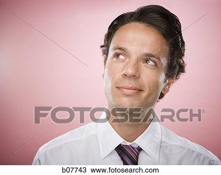 Stock Image - Businessman looking upwards. Fotosearch