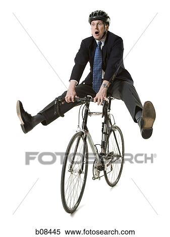 Businessman on a bicycle View Large Photo Image Stock Photography - Businessman on a bicycle. Fotosearch