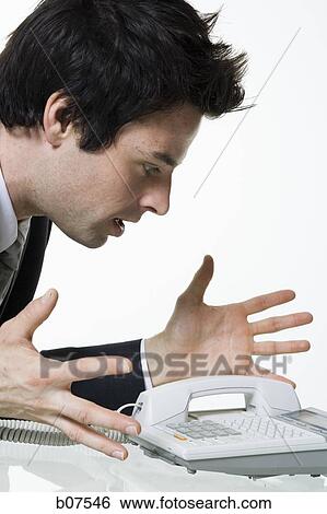 Businessman waiting anxiously for telephone call View Large Photo Image Stock Photograph - Businessman waiting anxiously for telephone call. Fotosearch