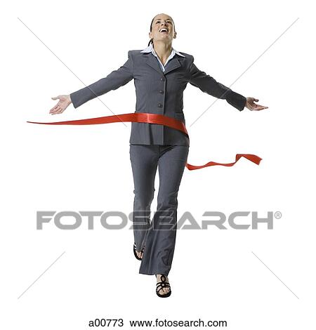 Stock Image - Businesswoman crossing finish line. Fotosearch