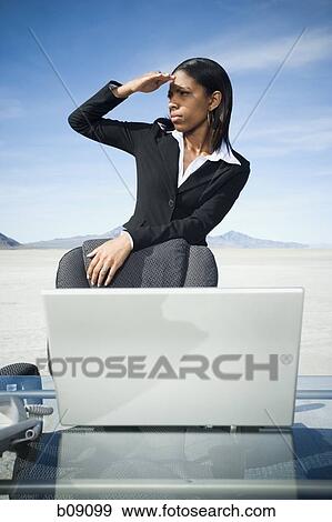Stock Photo - Businesswoman shielding her eyes. Fotosearch