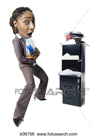 Businesswoman trying to get organized View Large Photo Image Stock Photograph - Businesswoman trying to get organized. Fotosearch