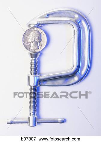 C-Clamp squeezing a US quarter View Large Photo Image Stock Photo - C-Clamp squeezing a US quarter. Fotosearch