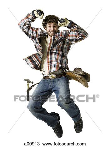 Carpenter jumping in the air View Large Photo Image Stock Image - Carpenter jumping in the air. Fotosearch