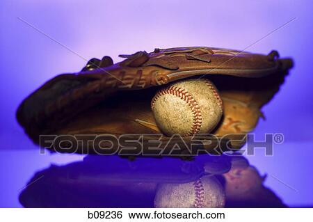 Close-up of a baseball in a baseball glove View Large Photo Image Stock Photograph - Close-up of a baseball in a baseball glove. Fotosearch