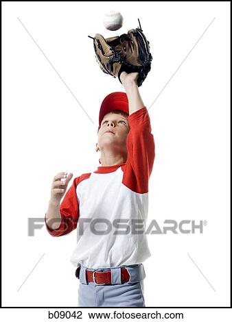 Close-up of a baseball player catching a baseball View Large Photo Image Stock Image - Close-up of a baseball player catching a baseball. Fotosearch