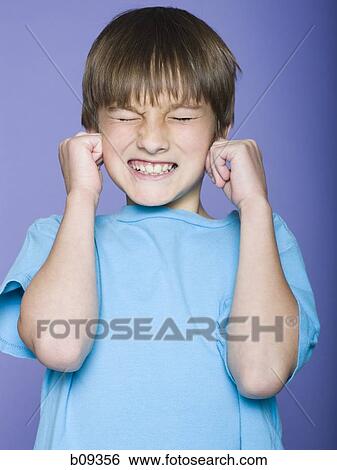 Close-up of a boy making a face View Large Photo Image Stock Photograph - Close-up of a boy making a face. Fotosearch