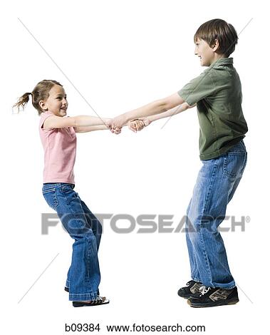 Picture - Close-up of a boy playing with his sister. Fotosearch