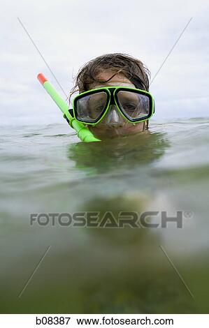 Close-up of a boy wearing a snorkel and swimming goggles View Large Photo Image Stock Photo - Close-up of a boy wearing a snorkel and swimming goggles. Fotosearch