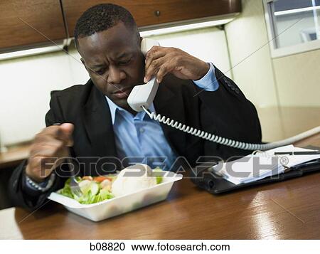 Close-up of a businessman talking on the telephone View Large Photo Image Stock Image - Close-up of a businessman talking on the telephone. Fotosearch