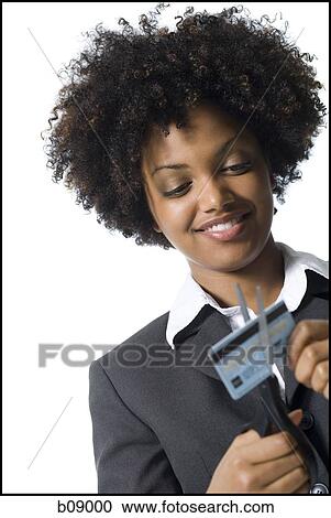 Close-up of a businesswoman cutting a credit card with a pair of scissors View Large Photo Image Stock Image - Close-up of a businesswoman cutting a credit card with a pair of scissors. Fotosearch