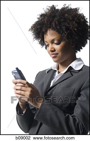 Close-up of a businesswoman holding a mobile phone View Large Photo Image Stock Image - Close-up of a businesswoman holding a mobile phone. Fotosearch