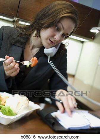 Close-up of a businesswoman talking on the telephone View Large Photo Image Stock Photograph - Close-up of a businesswoman talking on the telephone. Fotosearch