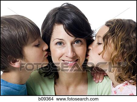 Picture - Close-up of a girl and a boy kissing their mother. Fotosearch