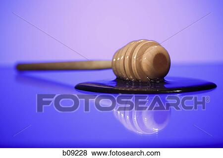 Close-up of a honey dipper with honey View Large Photo Image Stock Photo - Close-up of a honey dipper with honey. Fotosearch