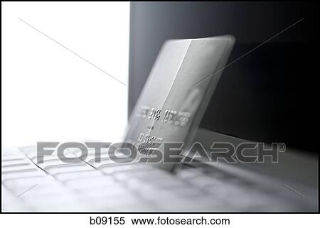 Close-up of a laptop and a credit card View Large Photo Image Stock Photography - Close-up of a laptop and a credit card. Fotosearch