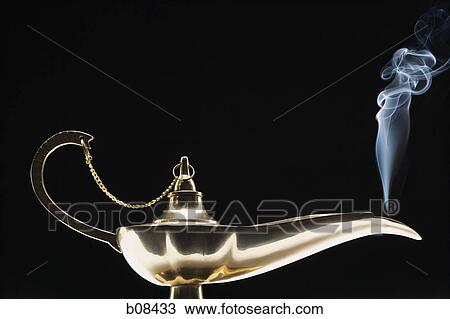 Stock Image - Close-up of a magic lamp emitting smoke. Fotosearch