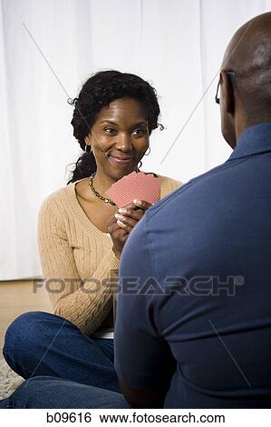 Close-up of a mature couple playing cards View Large Photo Image Stock Photograph - Close-up of a mature couple playing cards. Fotosearch