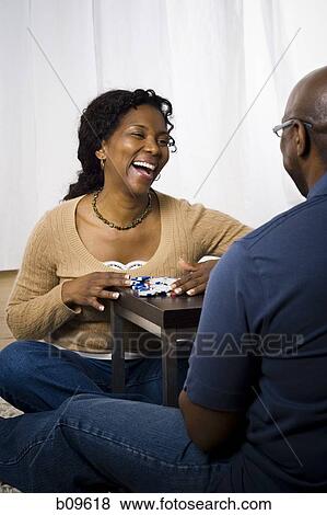 Close-up of a mature couple sitting face to face and smiling View Large Photo Image Stock Photo - Close-up of a mature couple sitting face to face and smiling. Fotosearch
