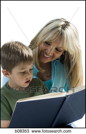 Close-up of a mother teaching her son View Large Photo Image Stock Image - Close-up of a mother teaching her son. Fotosearch