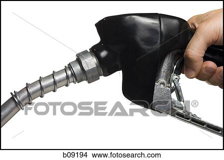 Close-up of a person's hand holding a fuel pump View Large Photo Image Picture - Close-up of a person's hand holding a fuel pump. Fotosearch