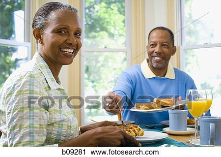 Close-up of a senior man and a senior woman having breakfast View Large Photo Image Stock Image - Close-up of a senior man and a senior woman having breakfast. Fotosearch