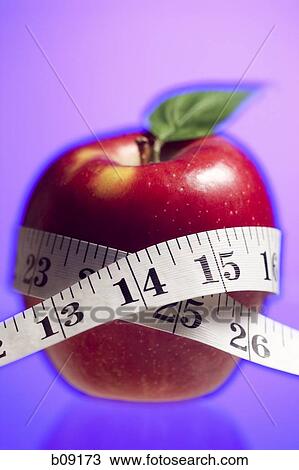 Close-up of a tape measure around an apple View Large Photo Image Stock Image - Close-up of a tape measure around an apple. Fotosearch