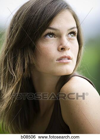 Stock Photograph - Close-up of a teenage girl looking up. Fotosearch